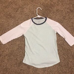 Long sleeve shirt with blue and white on it.